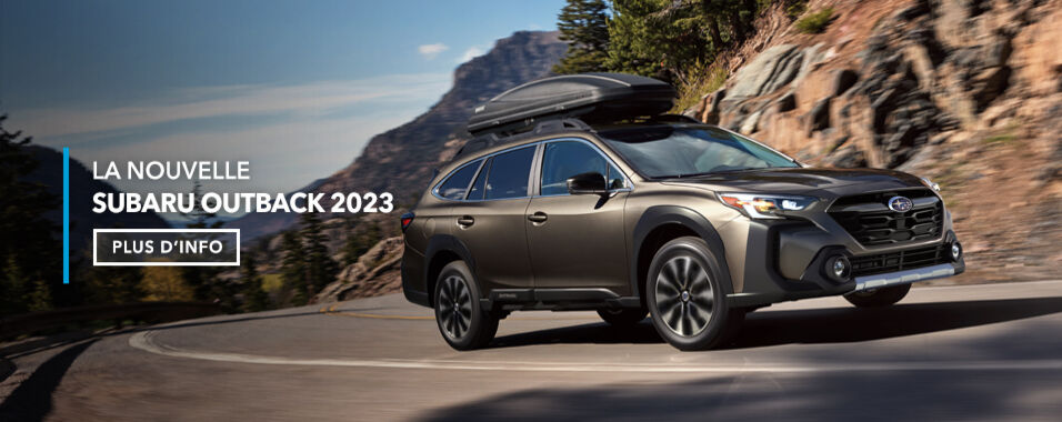 Subaru Outback 2023 en bronze brillant empruntant une courbe sur une route sinueuse.